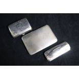 Two silver cigarette cases and a silver spectacles case.