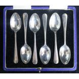 A set of six silver coffee spoons.