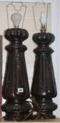 A pair of carved oak table lamp bases