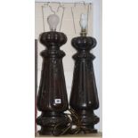 A pair of carved oak table lamp bases