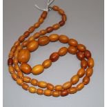 A single strand graduated oval amber bead necklace, gross 44 grams, 78cm.