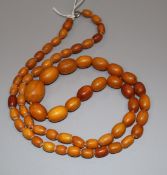 A single strand graduated oval amber bead necklace, gross 44 grams, 78cm.