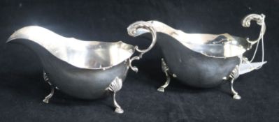 A pair of 1960's silver sauceboats with flying scroll handles. 15.5 oz.