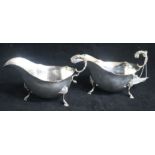 A pair of 1960's silver sauceboats with flying scroll handles. 15.5 oz.