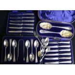 A cased matched pair of Georgian silver 'berry' spoons, a set of six teaspoons & tongs, two cased