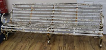 A 19th century white painted four seated slatted iron garden bench, W.212cm