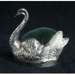 A large Edwardian novelty silver pin cushion modelled as a swan by Grey & Co, with inset leatherette