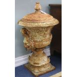 A pair of cast iron urns and covers, H.80cm