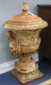 A pair of cast iron urns and covers, H.80cm
