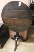 A Georgian oak tilt-top tripod table, W.67cm