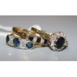 An 18ct gold, sapphire and diamond half hoop ring and two 9ct gold and gem set rings.