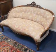 A Victorian carved walnut settee, W.167cm