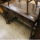 An oak side table with two drawers, W.107cm