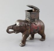 An American painted cast iron elephant and howdah money bank, 6.5in.