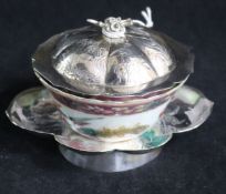 A Chinese silver dish and a porcelain bowl.