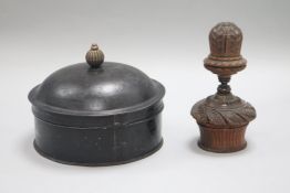 A carved treen nutmeg grater and a tin nutmeg grater and spice box