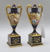 A pair of Vienna blue ground vases