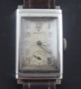 A gentleman's 1930's stainless steel Rolex manual wind wrist watch, with rectangular Arabic dial and