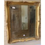 A gilt frame wall mirror, H.84cm
