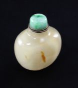 A Chinese chalcedony snuff bottle, late 19th / early 20th century, of flattened ovoid form with a