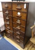 A 1920's nest of filing drawers, W.77cm