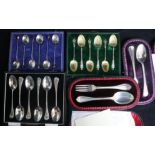 Three cased sets of six silver teaspoons including one with tiger's eye quartz terminals and two