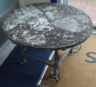 A circular garden table, W.86cm