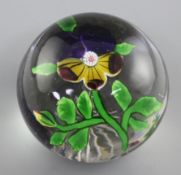 A Baccarat magnum 'pansy' glass paperweight, 19th century, with star cut base, diameter 8cm