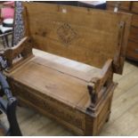 An oak monks bench, W.107cm