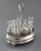 A George III silver eight bottle oval cruet stand by Peter, Ann & William Bateman, London, 1800,