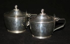 A pair of Victorian silver oval mustard pots with blue glass liners, Frederick Brasted, London,