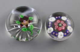 A Baccarat 'pansy' glass paperweight, 19th century, with star cut base, diameter 6cm, and a small