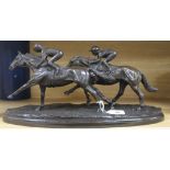 A resin group of two racehorses