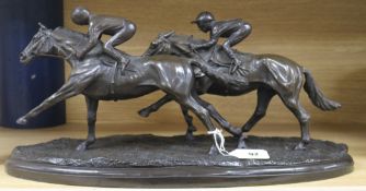 A resin group of two racehorses