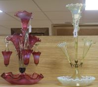 A Victorian cranberry glass epergne and a pale yellow vaseline glass epergne, the cranberry