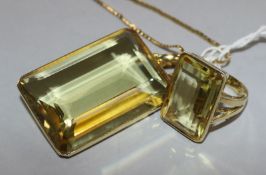 A modern 14ct gold mounted large citrine pendant on 9ct gold chain and a similar 14ct gold dress