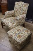 A George III style upholstered armchair and a footstool
