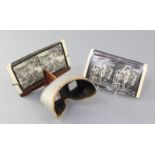 A late 19th / early 20th century Underwood & Underwood stereoscopic slide viewer, with a selection