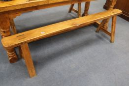 A pair of French farmhouse benches, W.179cm