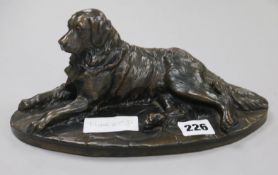 A Martin (20th century). A bronzed reclining model of a retriever