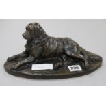 A Martin (20th century). A bronzed reclining model of a retriever