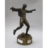 A bronze figure of a footballer
