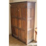 A panelled oak cupboard, H.184cm