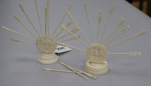 Two ivory cocktail stick holders