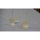 Two ivory cocktail stick holders