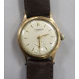 A gentleman's 9ct gold J.W. Benson manual wind wrist watch with presentation inscription on the back