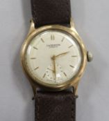 A gentleman's 9ct gold J.W. Benson manual wind wrist watch with presentation inscription on the back