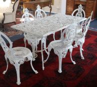 A garden table and six chairs, W.142cm