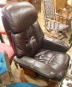 A leather adjustable reclining chair