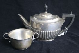 An Edwardian demi fluted silver oval teapot by William Hutton & Sons, London, 1907 and a silver